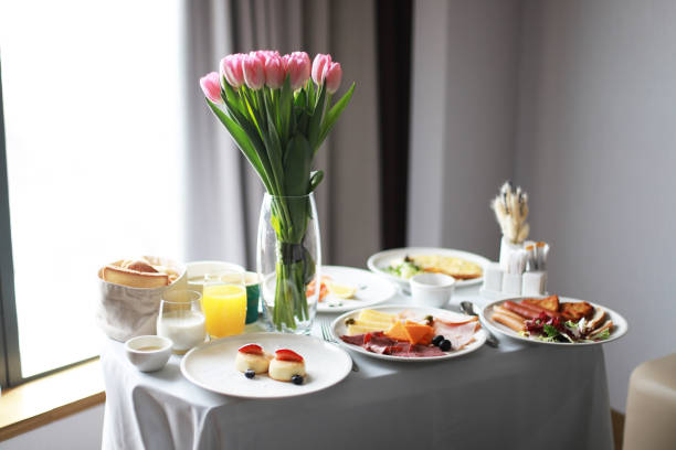 istock Breakfast cart with tulips, room service 1473445232