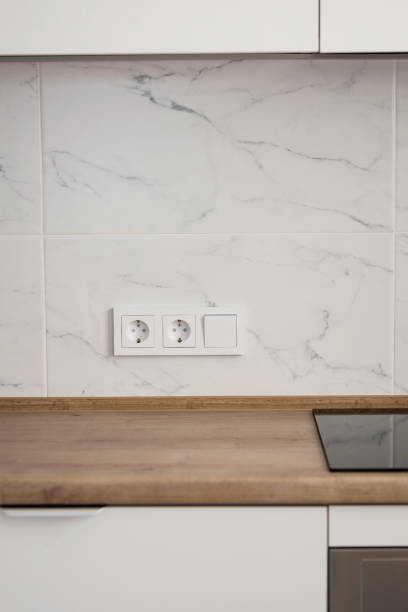 istock group of white european electrical outlets and a switch 1473445394