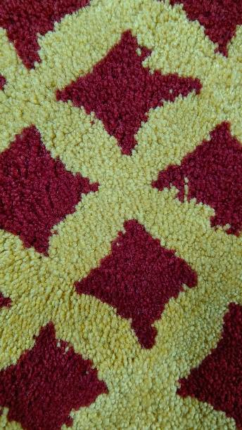 istock The red yellow pattern of a rug 1473445519