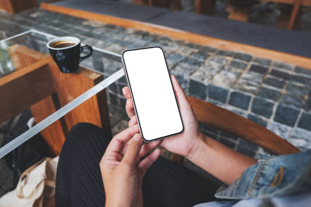 istock Mockup image of hands holding mobile phone with blank desktop screen 1473446368