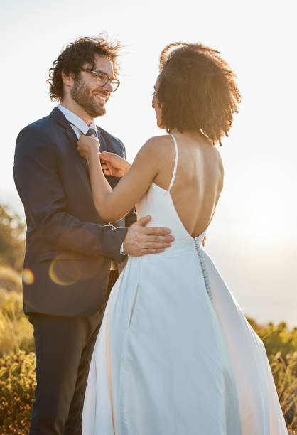 istock Wedding, nature and couple on mountain for marriage ceremony, commitment and celebration. Trust, love and interracial bride and groom loving, happy and smile ready for romance, bonding and affection 1473447617