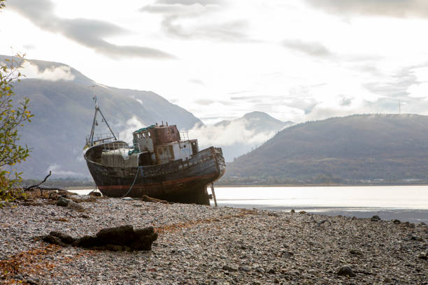 istock Old abandoned boat at the side of a loch 1473449967