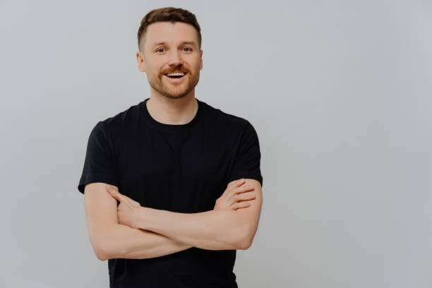 istock Positive young man posing in studio with happy facial expression 1473451366