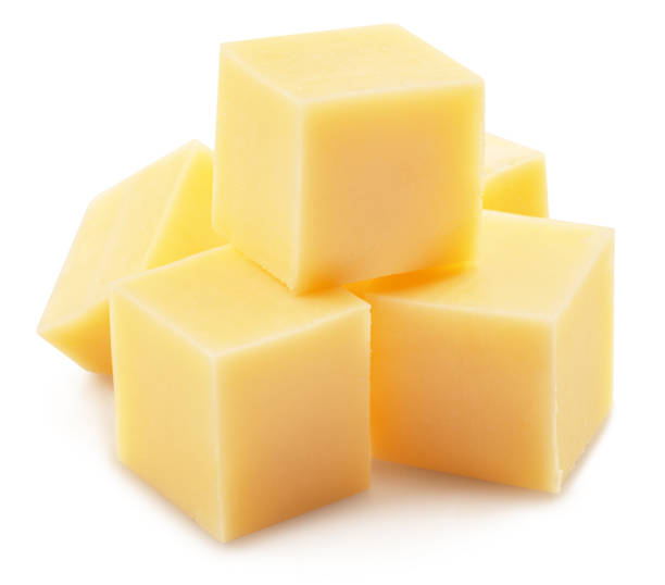 istock Pyramid of cheese cubes isolated on white background. 1473452676