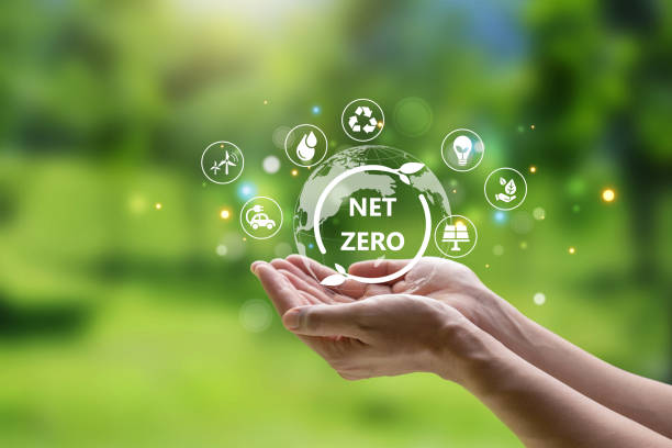istock Hand of human holding earth with Net Zero icon. 1473453587