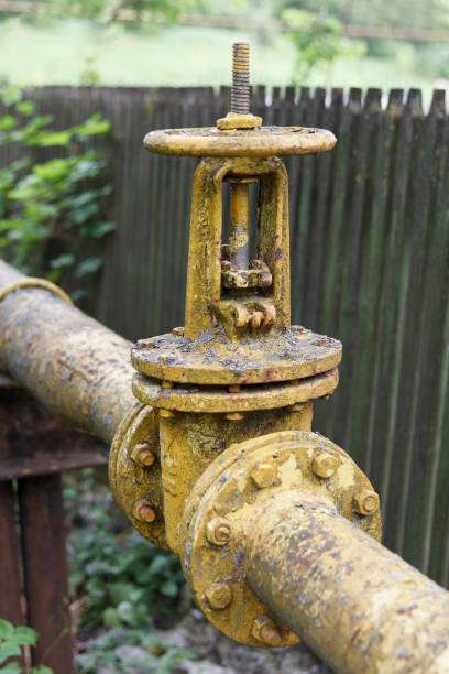 istock Gas pipe with large old valve-crane. 1473456309