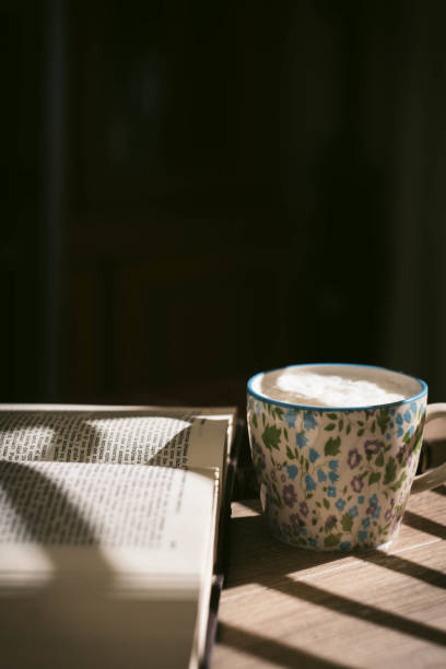 istock High Angle View Of Coffee Cup On Warm Clothing. 1473458972