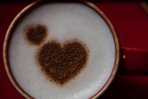 Coffee beans in the form of a valentine heart. Coffee texture and background