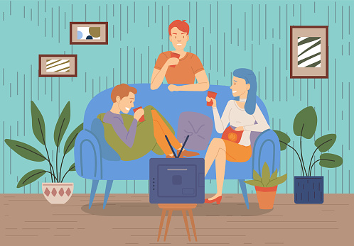 Smiling friends drinking tea at home Happy women laughing and gossiping sit on comfortable couch. People spending time together having friendly conversation. Female characters relax and communicate