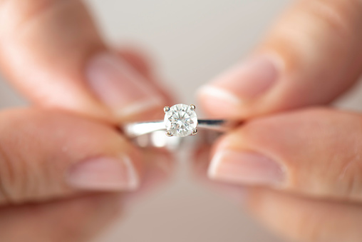 Woman Holding a Diamond Ring