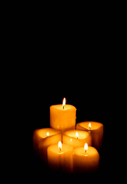 Set of candles on a black background with copy space. Holy Week, Good Friday, Pentecost, Religiosity and spirituality Set of candles on a black background with copy space. Holy Week, Good Friday, Pentecost, Religiosity and spirituality pentecost religious celebration photos stock pictures, royalty-free photos & images