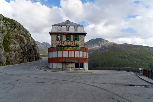 The Belvedere Hotel is a historic mountain lodge located at the summit of the Furka Pass in Switzerland. This iconic hotel was originally built in 1882 and has been a favorite destination for tourists and mountaineers ever since.

Perched at an altitude of 2,429 meters (7,969 feet), the Belvedere Hotel offers stunning panoramic views of the surrounding Swiss Alps. The hotel's location at the summit of the Furka Pass also makes it an ideal starting point for exploring the nearby glaciers, valleys, and peaks.