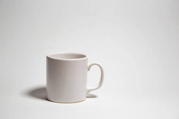 istock White cup for coffee on white background, isolated, copy space, space for text 1473463926