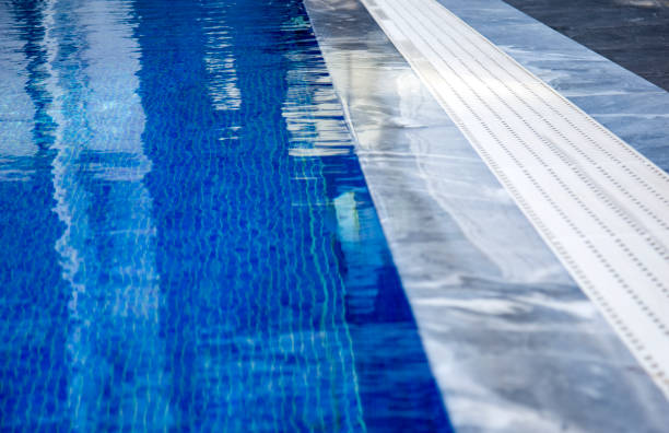 istock Swimming pool with clean blue water 1473464224