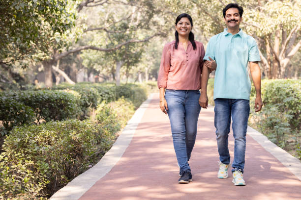 Happy couple admiring view while walking at park