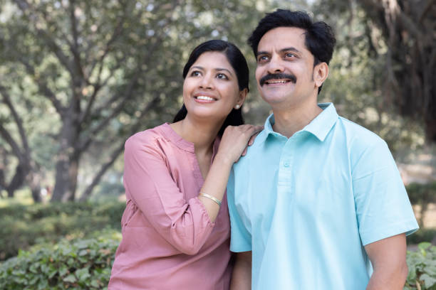 istock Happy couple walking at park 1473466139