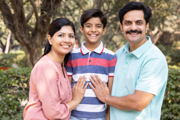 istock Happy Indian family at park 1473466157