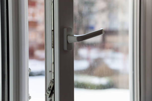 istock Open white plastic pvc window in winter on a cloudy day. 1473468656
