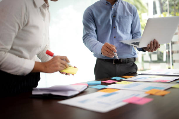 istock Business sales consultant discussing in data documents at modern office. 1473469306