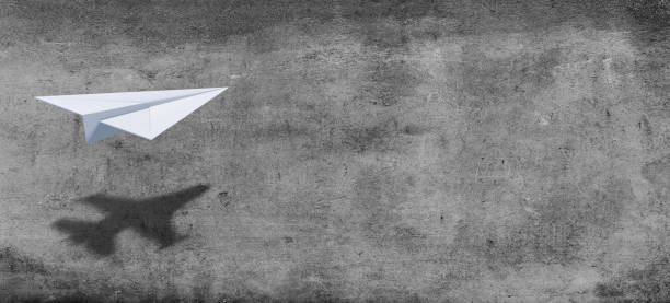 istock Big idea, startup and motivation concept. Paper plane with shadow on concrete wall background. 1473469398