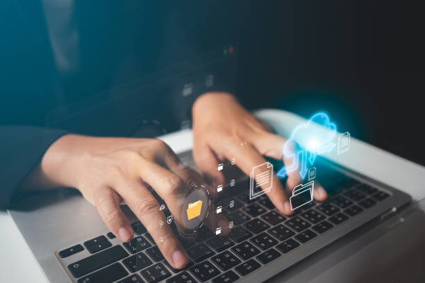istock Businesswoman managing online data and documents in cloud on virtual screen, highly secured storage, easy and quick to use information. 1473469954