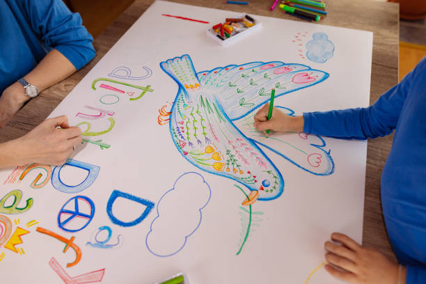 istock Mother and Daughter Creating Art for Peace 1473470823