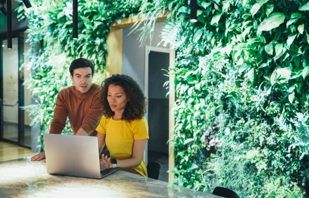 istock Business people working in modern Green office space 1473471007