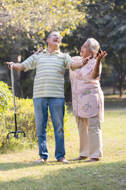 istock Laughing senior couple spending leisure time at park 1473471887