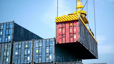 Shore Crane Loading Containers In Freight Ship - 4K Resolution