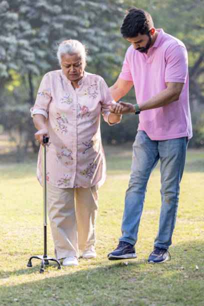 istock My therapist has helped me walk at park. 1473472059