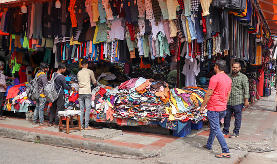 A Street shop selling ready to wear garments in variety of designs and colors at a discounted price in the Kochi city of Kerala, India.