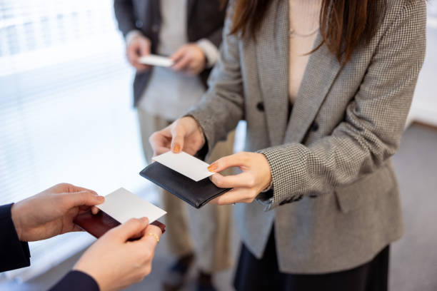 istock Business people changing business card 1473474888