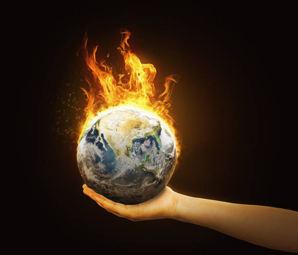istock Environmentalist supports burning Planet Earth on her hand: she cares about climate change 1473475058