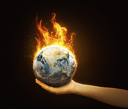 Woman holds a fiery flaming Earth in the palm of her hand. Public domain satellite image from https://www.nasa.gov/multimedia/imagegallery/image_feature_2159.html