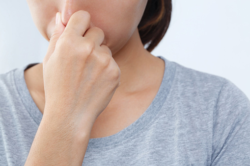 A foul smell when breathing may be caused by. 1. Infections in the nasal cavity such as colds, flu, sinusitis.