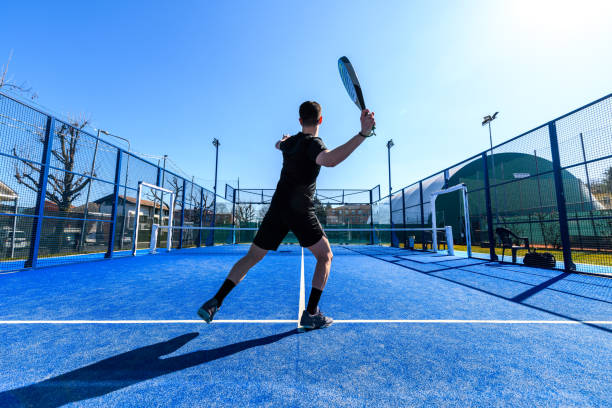 young people playing padel tennis - the paddle racket imagens e fotografias de stock