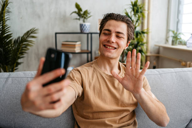 istock Young Man Having A Video Call At Home 1473484619