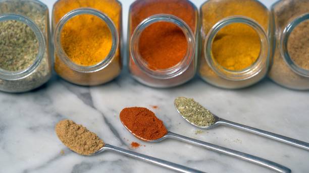 istock Spices for cooking - Cumin, paprika, curry, turmeric, chilli pepper, pepper, salt, ginger are typical spices of African Moroccan Indian cuisine - health and well-being in  kitchen - Mediterranean diet 1473486264