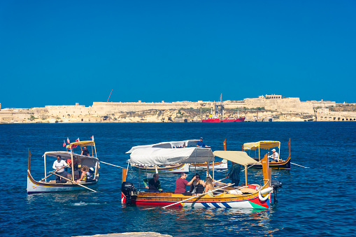 Birgu, Malta, 22 May 2022: Traditional boat in the harbor of Birgu