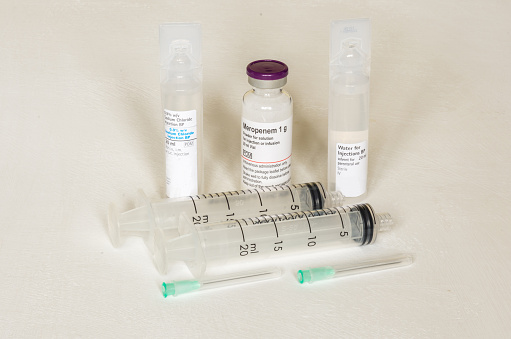 Set of materials including saline, antibiotic, and sterile water with syringes and needles suitable for intravenous injection