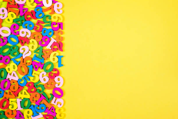 istock Colorful Wooden Numbers Background on Yellow 1473495287