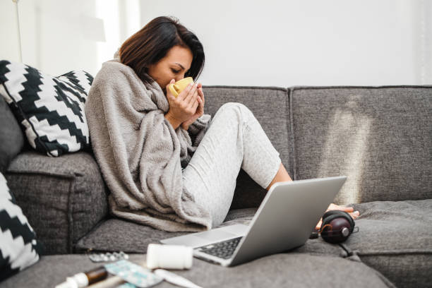 istock Sick woman at home 1473495717