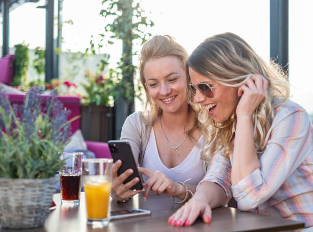 istock women are looking at the phone 1473495721