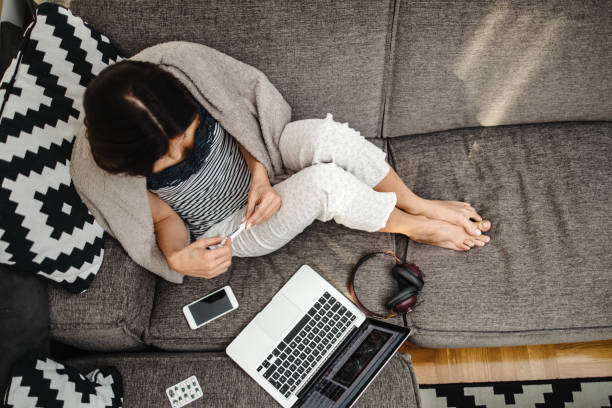 istock Sick woman at home 1473495746