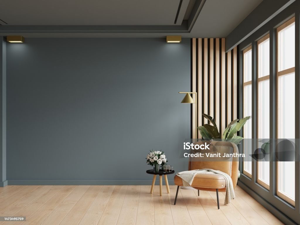 Gemütliches modernes Wohnzimmer Interieur mit Ledersessel und Dekorationsraum auf leerem dunkelblauem Wandhintergrund. - Lizenzfrei Büro Stock-Foto Gemütliches modernes Wohnzimmer Interieur mit Ledersessel und Dekorationsraum auf leerem dunkelblauem Wandhintergrund. - Lizenzfrei Büro Stock-Foto