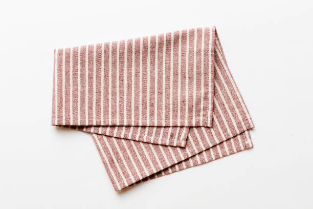 istock top view with red empty kitchen napkin isolated on table background. Folded cloth for mockup with copy space, Flat lay. Minimal style 1473497819