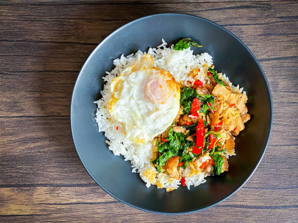 istock Rice topped with crispy pork belly with Thai basil and fried egg 1473498987
