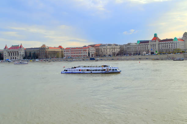 Budapest, Hungary, March 19, 2019: Spring Budapest, Danube river, dusk pleasure boat on the river