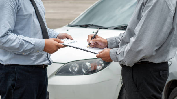 istock senior man and insurance agent claim process after car crash. 1473499258