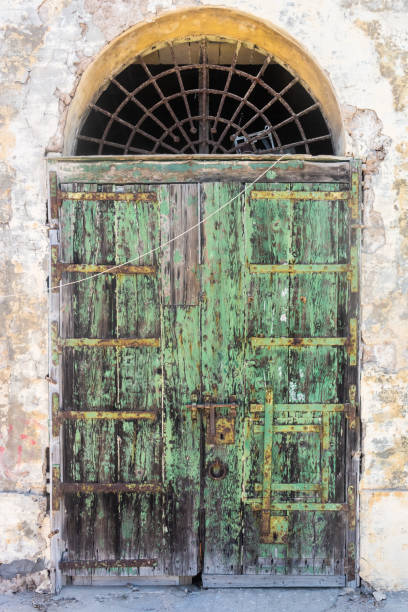 istock Very old and rusty door in the ancient Valletta harbor,  Malta 1473500330